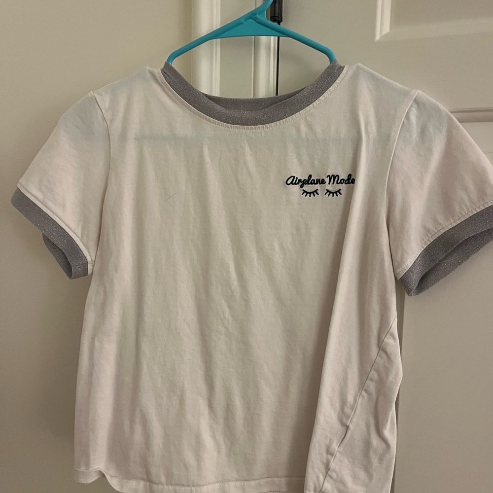 White Tee with Embroidered Detail and silver trim.